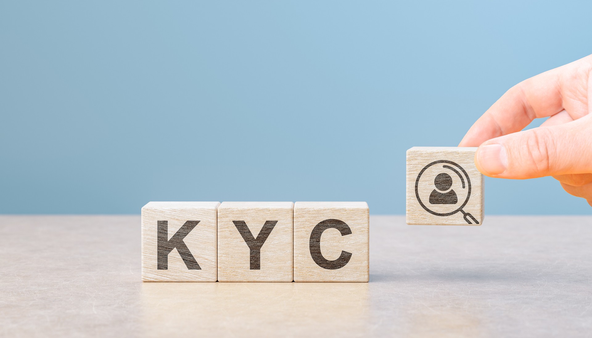 KYC Know Your Customer on wooden cubes. Business verifying the identity of its clients concept. Financial client authentication. copy space